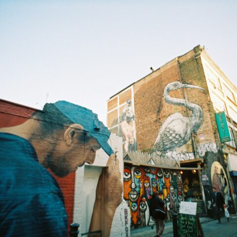 man in blue shirt standing beside man in blue shirt