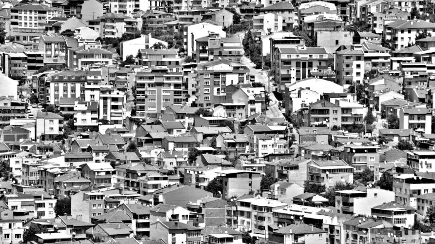 grayscale photo of city buildings
